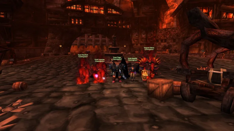 A small guild group posing in an orange-lit stone hall.