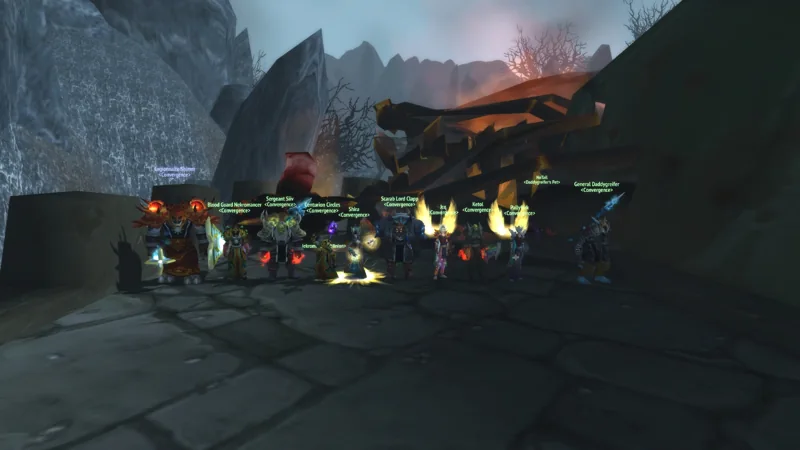Guild members posing together outside a stone fortress.