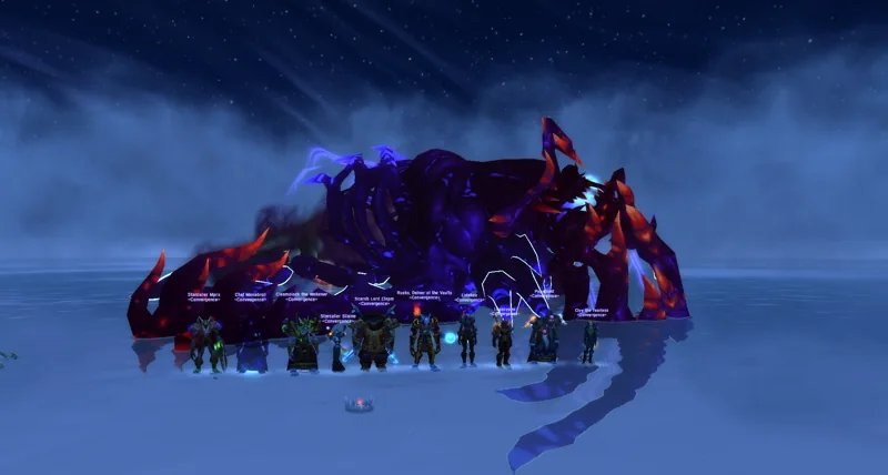 The guild gathered beneath a starry sky beside a fallen dragon.